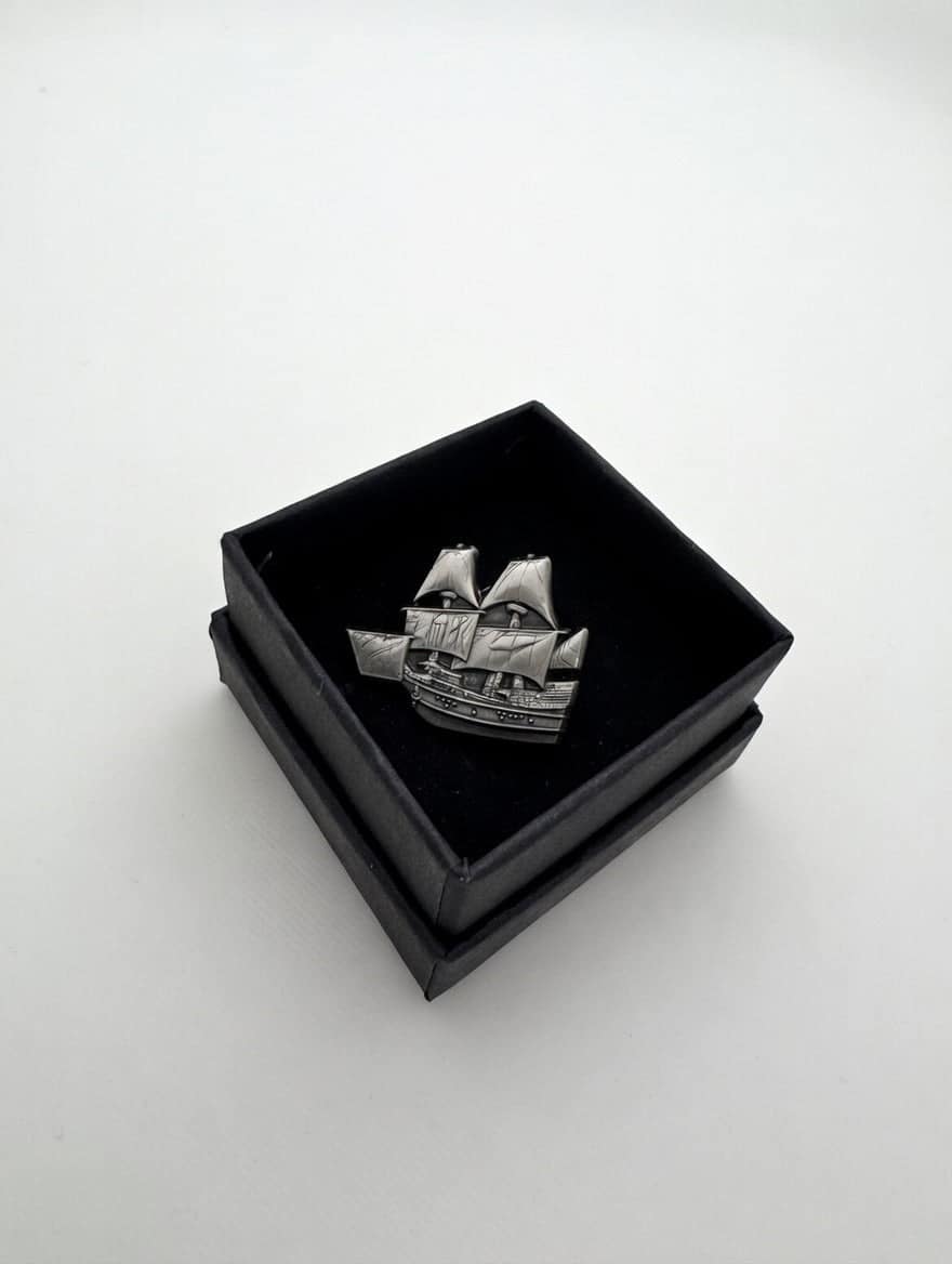 The Mayflower pin in its lidded presentation box, open